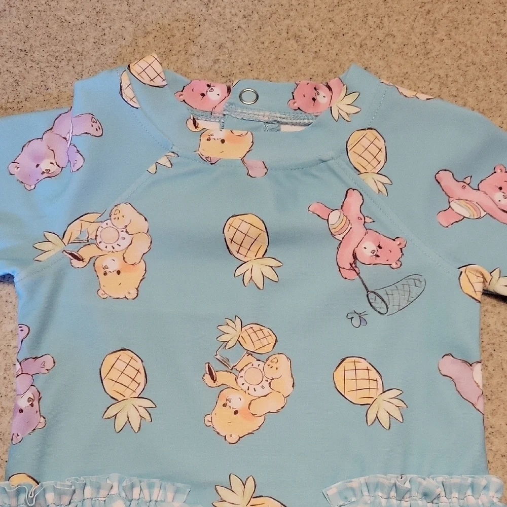 Care BearsOne Piece Swim Rashguard SIZE 3-6 months Nwt